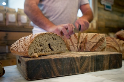 Bread being sliced at Gaston's Bakery in Boise, Idaho