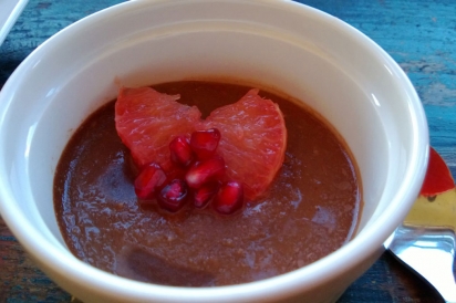 Grapefruit infused chocolate mousse with segmented grapefruit and pomegranate seeds