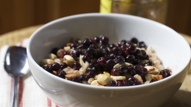 Warm Farro Breakfast Bowl with Hazelnuts, Honey and Huckleberries, Adapted from Whole Grain Mornings by Megan Gordon.